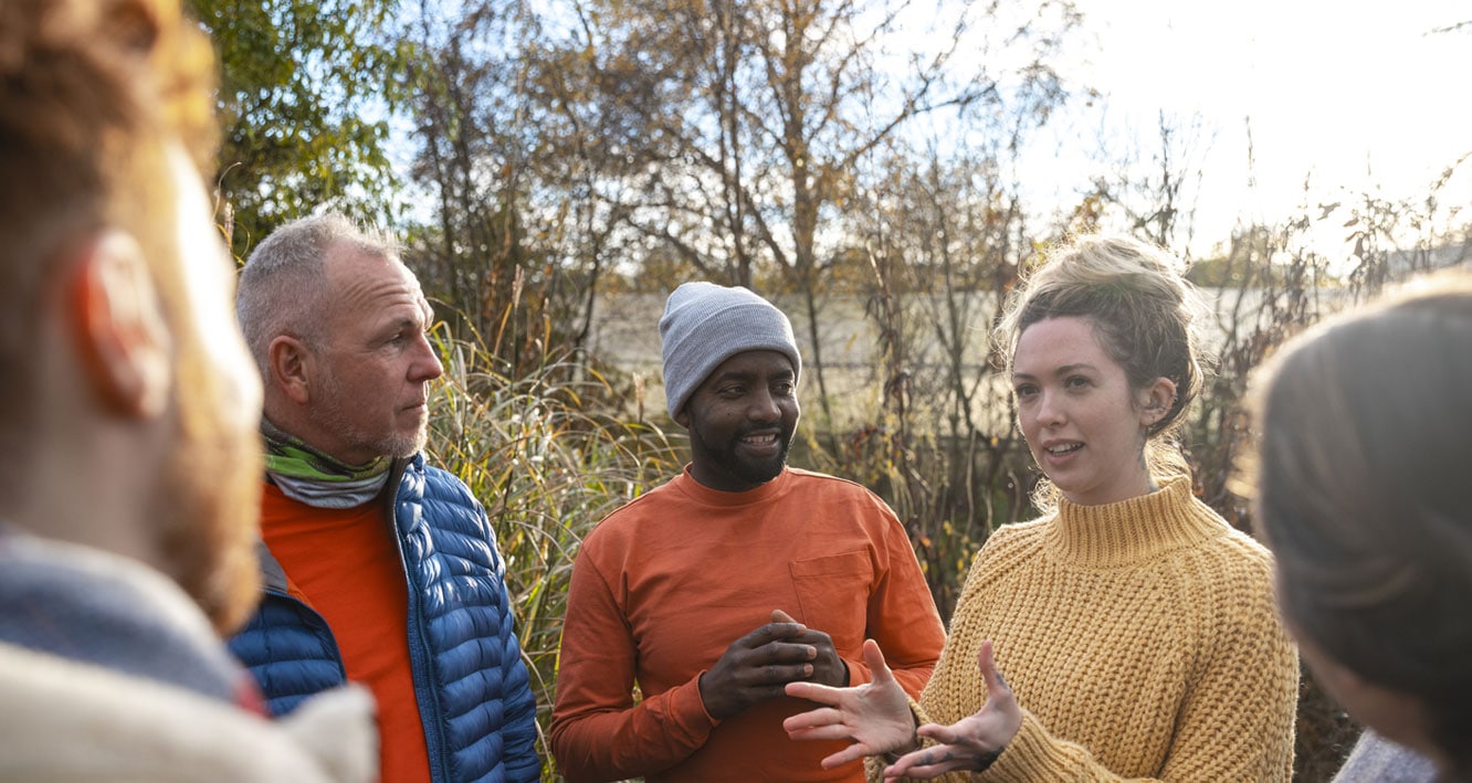 Diverse group of neighbors talking outside