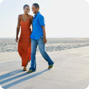 Couple walking along the shoreline