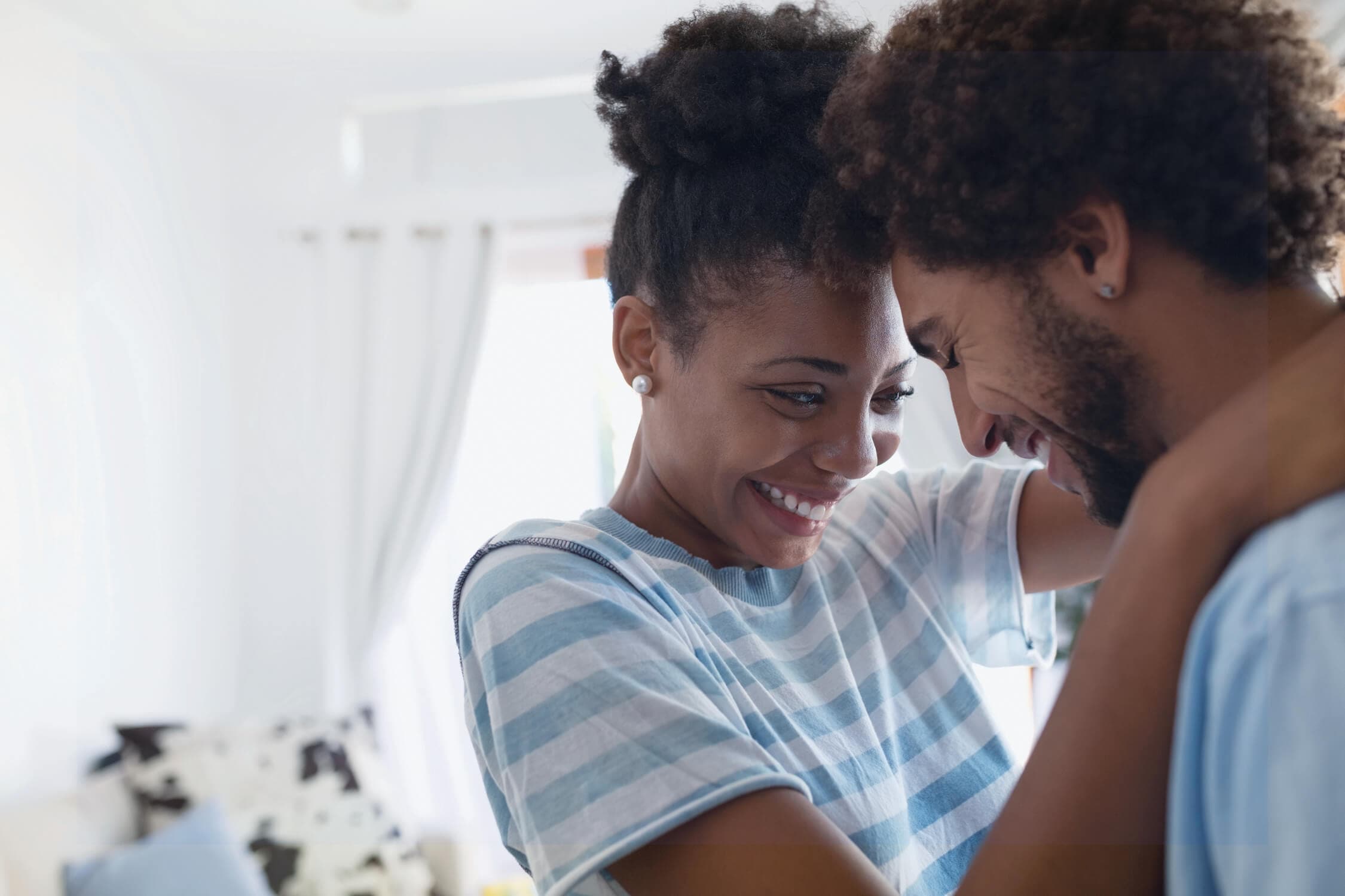 A couple hugging and smiling