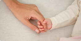 baby hand holding a woman's hand