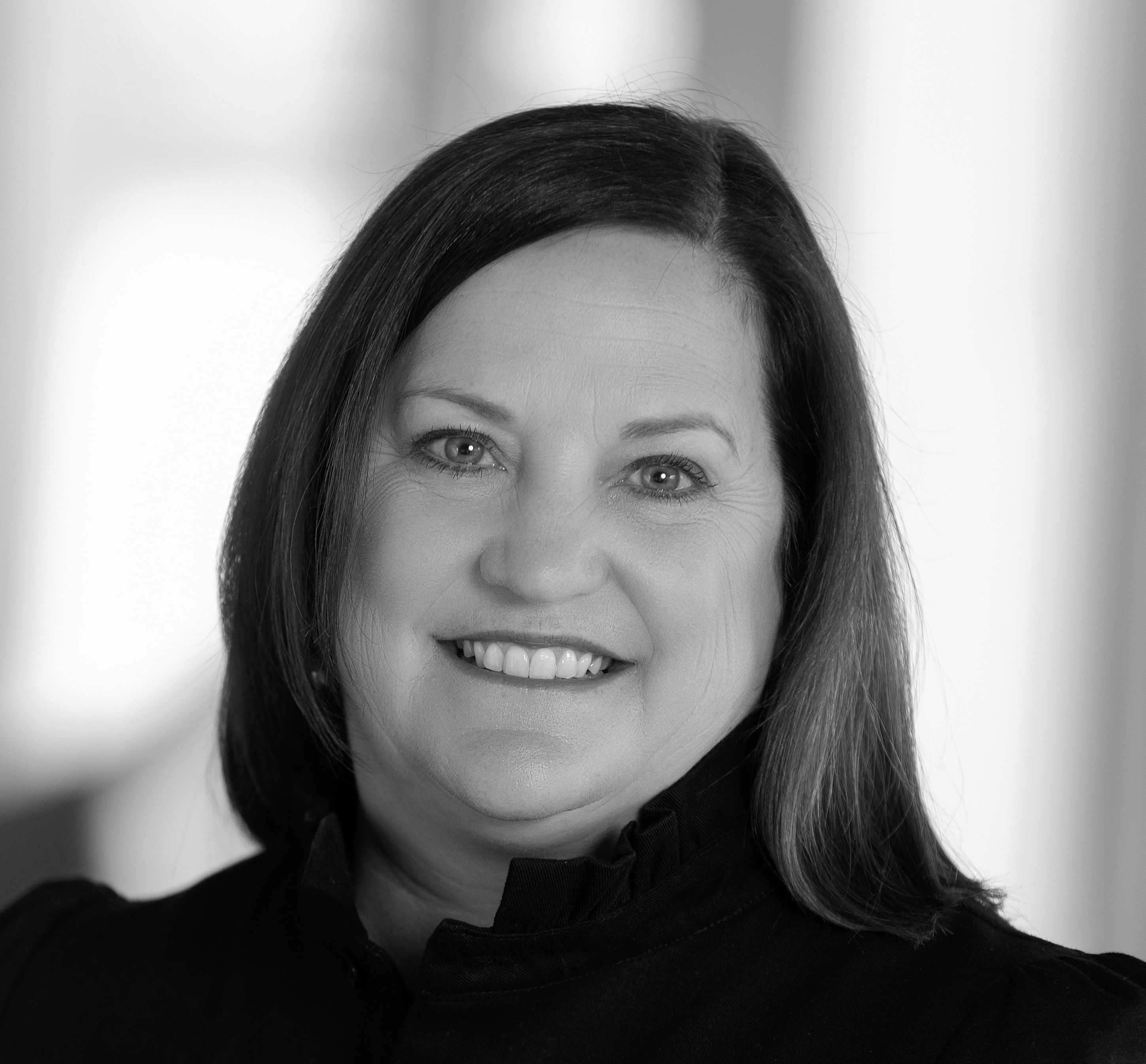 black and white headshot photo of Frances Thomas, Head of Distribution Platforms, Readiness & Strategy